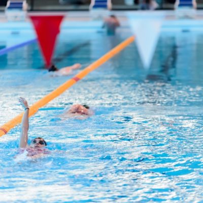 Women swimming in a lane