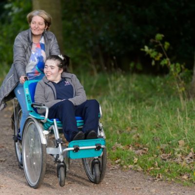 Wheelchair user with carer on a wheelchair bike