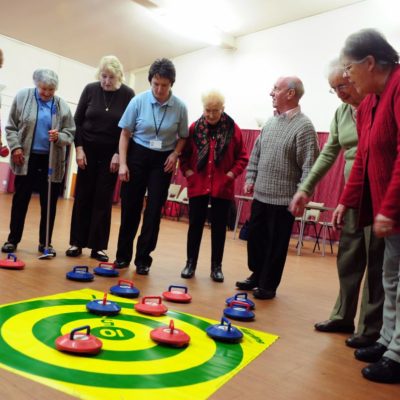 Group of Seniors looking at Kurling target