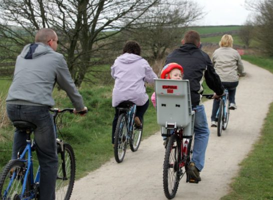 Family cycling in the countryside