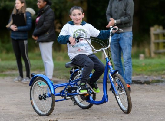 Child cycling on an inclusive Trike