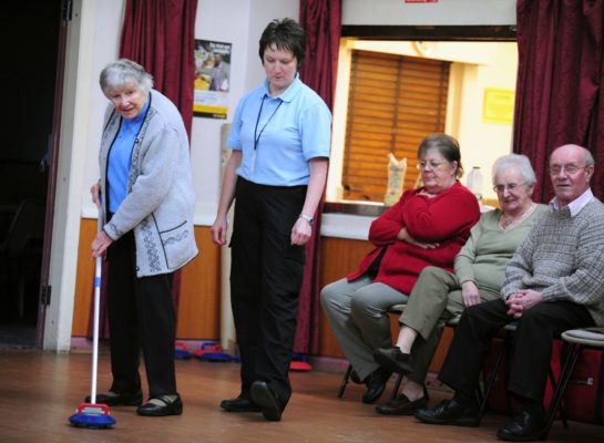 Senior lady using a Kurling Pusher