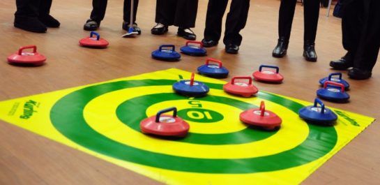 Group of Seniors looking at Kurling target