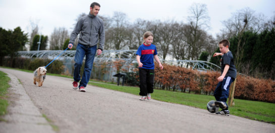 Family walking with dog