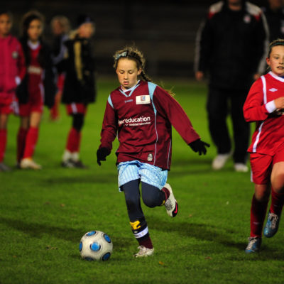 Girls playing football