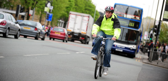 Man cycling on road