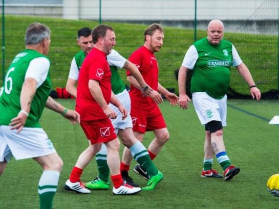 Men playing walking football on 3G pitch