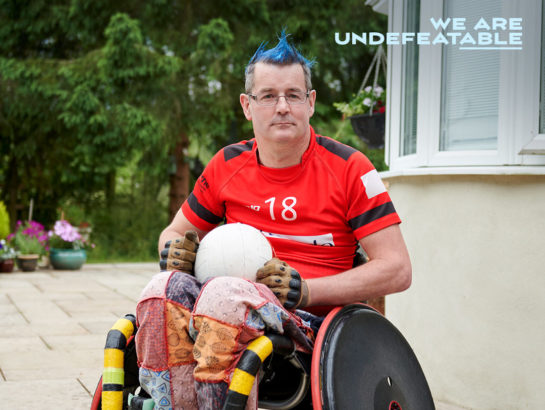 man in wheelchair ready to play wheelchair rugby