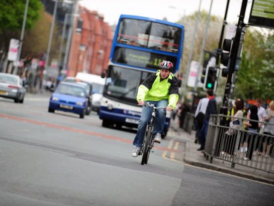 Man cycling to work in the city