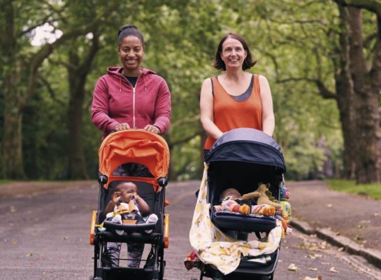 Two Women walking with pushchairs