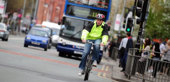 Man cycling to work in the city