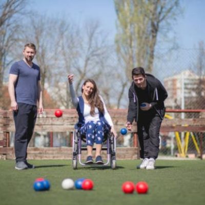Woman in wheelchair playing Bocchia