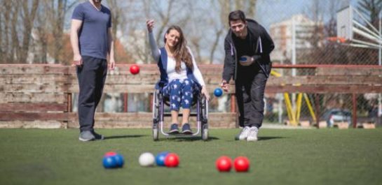 Woman in wheelchair playing Bocchia