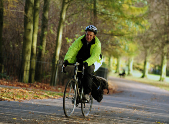 Man cycling on pavement