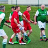 Men playing walking football on 3G pitch