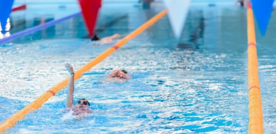 Women swimming in a lane