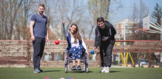 Woman in wheelchair playing Bocchia