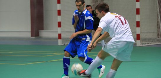 Men playing futsal