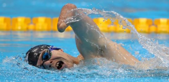 Man swimming in Para event