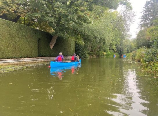 Two people canoeing on the canal