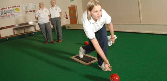 woman playing bowls
