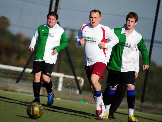 Group of men playing football