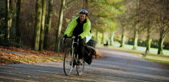 Man cycling on pavement