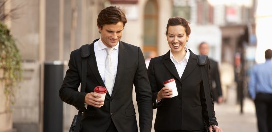 Businessman and businesswoman on their way to work